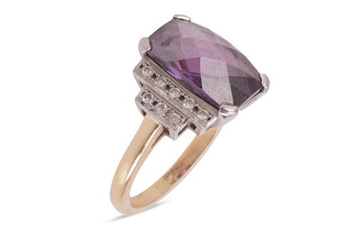 Lot 100 - An amethyst and diamond dress ring, set with a...