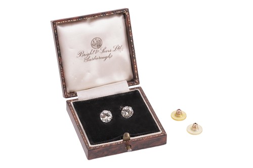 Lot 60 - A pair of diamond stud earrings, each set with...