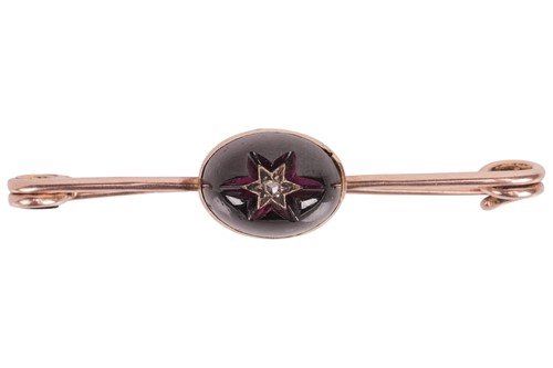 Lot 6 - An amethyst and diamond bar brooch, the...
