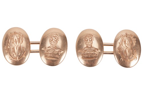 Lot 10 - A pair of cufflinks, the oval domed heads...