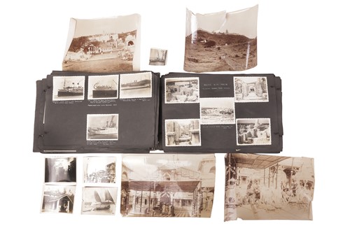 Lot An early 20th-century world photograph album,...