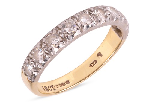 Lot 17 - A diamond half eternity ring, set with nine...