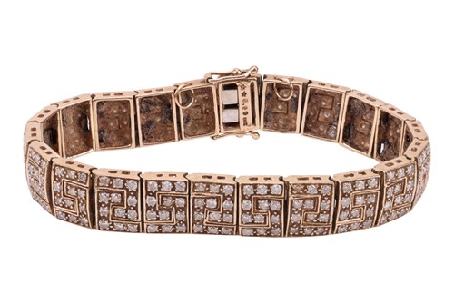 Lot 109 - A diamond set bracelet, of panel design, each...