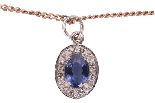 Lot 51 - A sapphire and diamond pendant and chain, the...