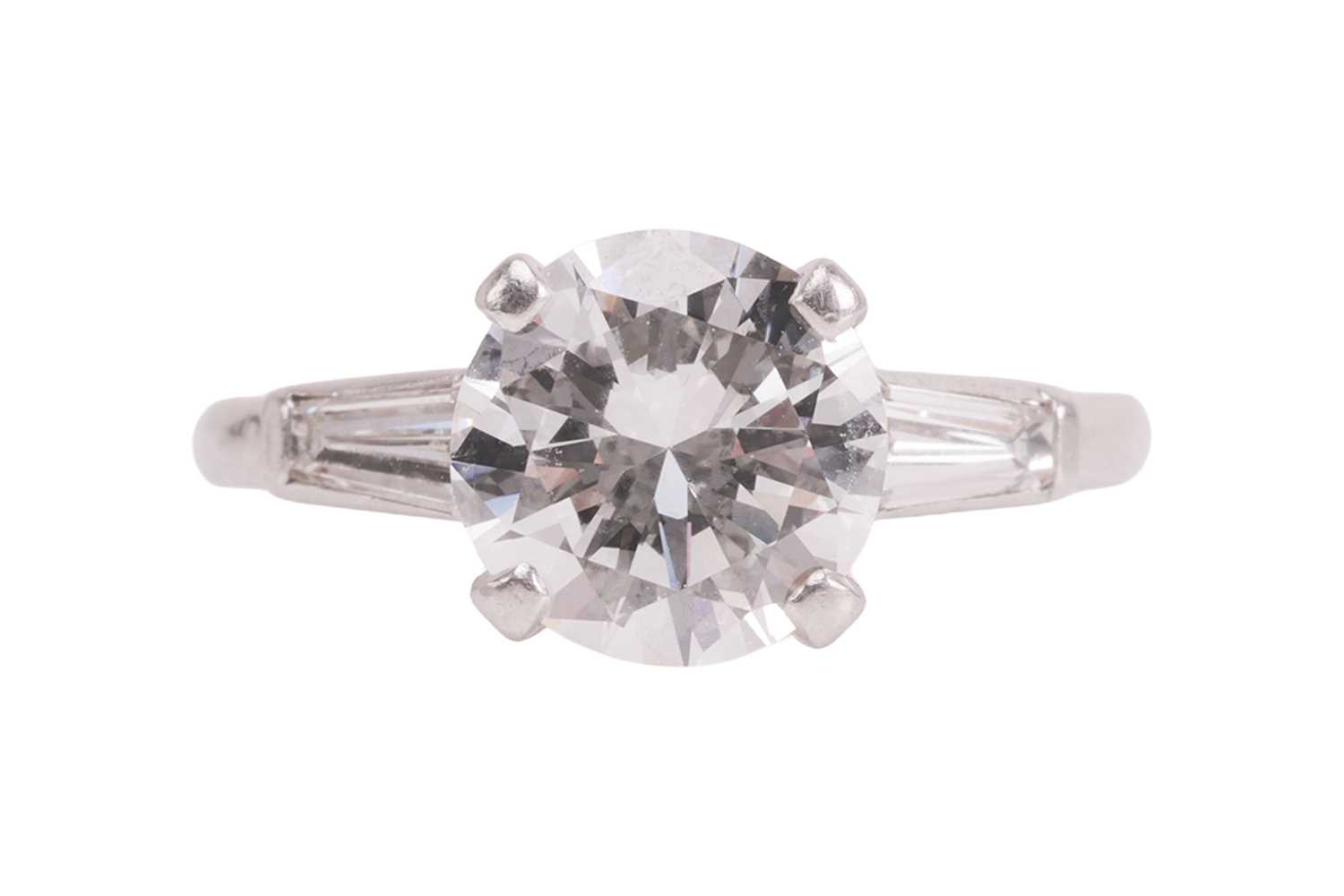 Lot 55 - An Art Deco diamond solitaire ring, featuring...