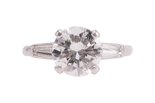 Lot 55 - An Art Deco diamond solitaire ring, featuring...