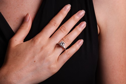 Lot 55 - An Art Deco diamond solitaire ring, featuring...