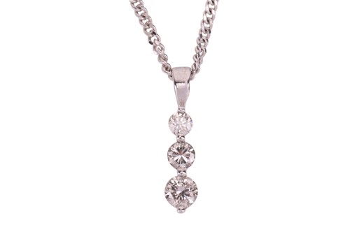 Lot 151 - A three-stone diamond pendant, claw-set with...
