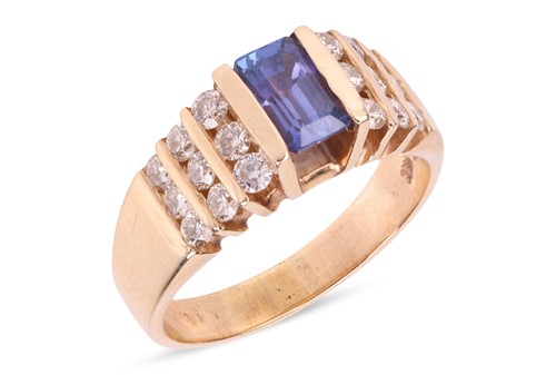 Lot 146 - A tanzanite and diamond dress ring, centred...