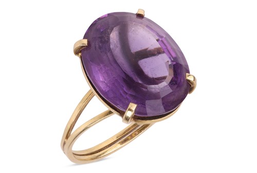 Lot 97 - An amethyst dress ring, comprising a mixed-cut...