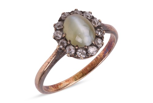 Lot 3 - A chrysoberyl and diamond halo ring, centred...