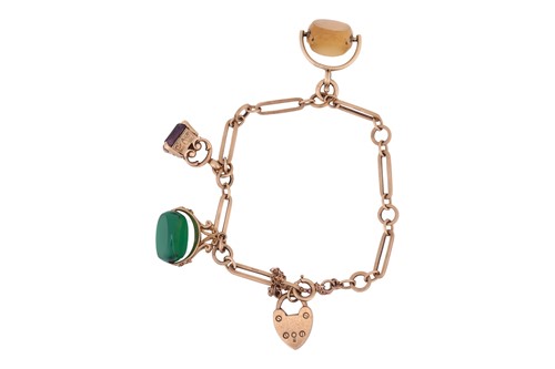 Lot 4 - A 9ct charm bracelet, set with three...