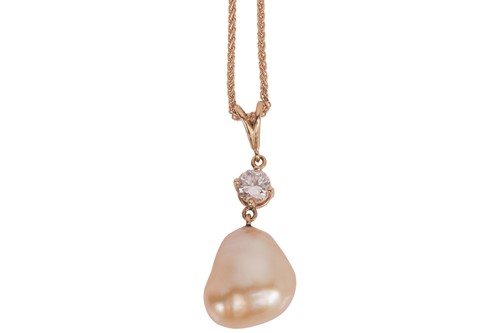Lot 106 - A cultured baroque pearl and diamond pendant...