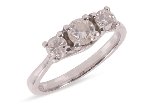 Lot 154 - A diamond-set three-stone ring, composed of...