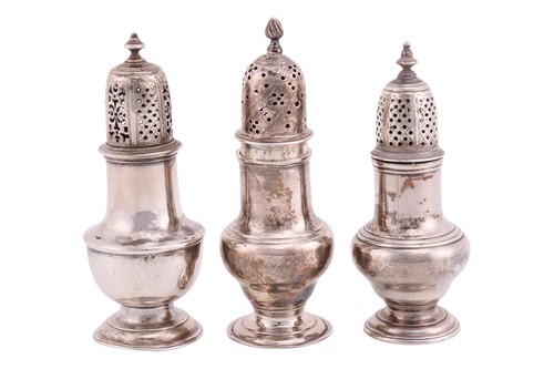 Lot 267 - Three George III silver casters; the first...