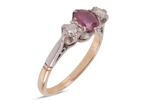 Lot 46 - A ruby and diamond trilogy ring; set with an...