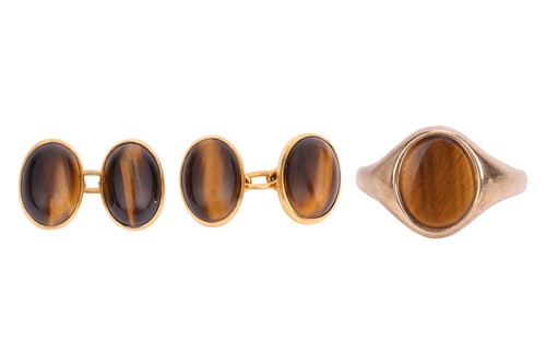 Lot 76 - A tigers eye signet ring, inset with an oval...