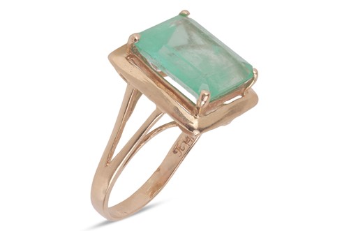 Lot 137 - An emerald-set ring, composed of a step-cut...
