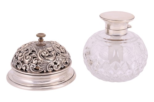 Lot 231 - A silver table bell with scrolling repousse...
