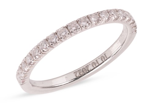 Lot 153 - A diamond half-eternity ring, featuring...