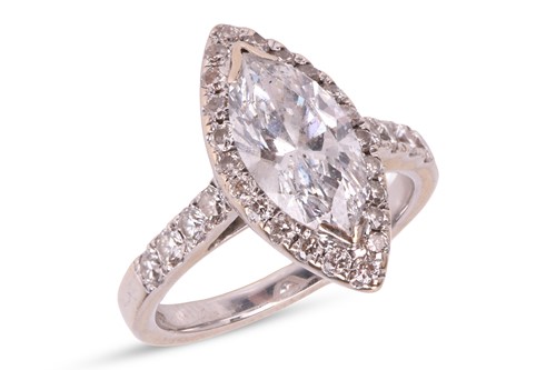 Lot 102 - A diamond solitaire ring, featuring a central...