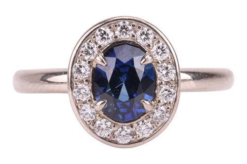 Lot A sapphire & diamond cluster ring, featuring a...