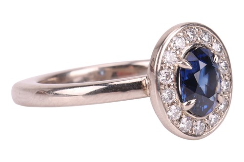 Lot A sapphire & diamond cluster ring, featuring a...