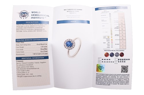 Lot A sapphire & diamond cluster ring, featuring a...