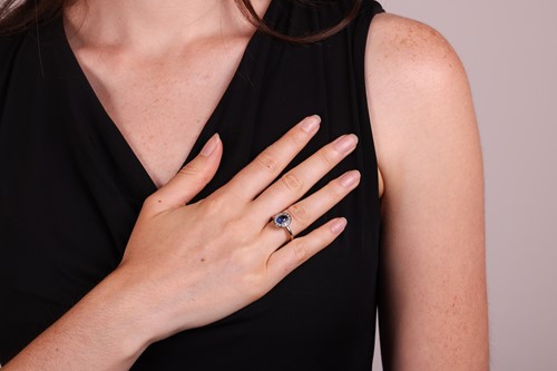 Lot A sapphire & diamond cluster ring, featuring a...