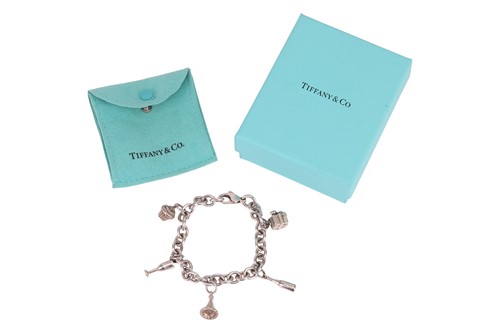 Lot 24 - Tiffany & Co. - A 'Party' charm bracelet,...