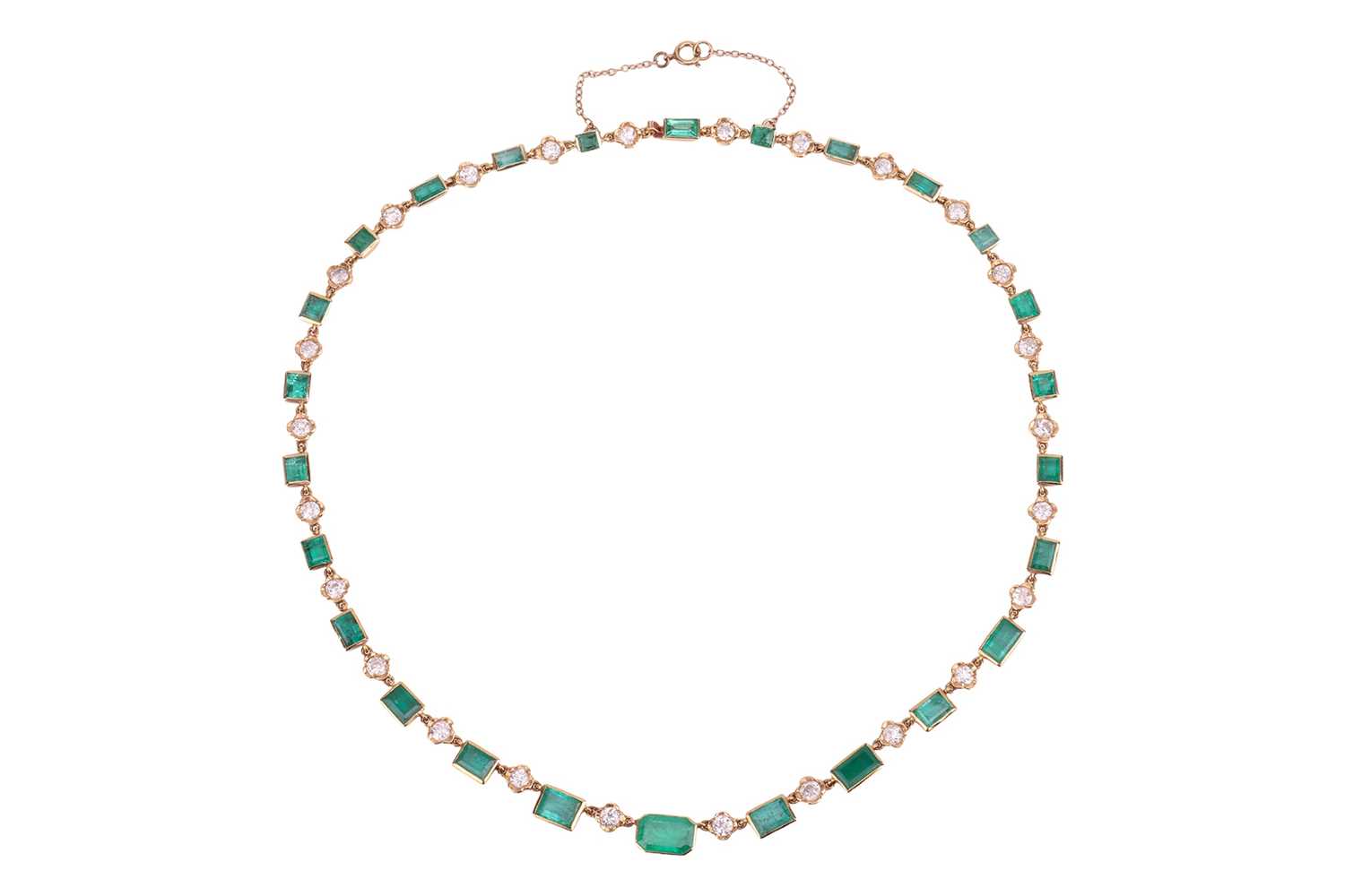 Lot 58 - An emerald and diamond necklace, comprising...