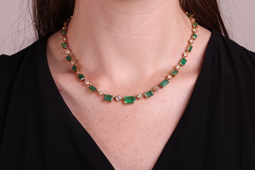 Lot 58 - An emerald and diamond necklace, comprising...