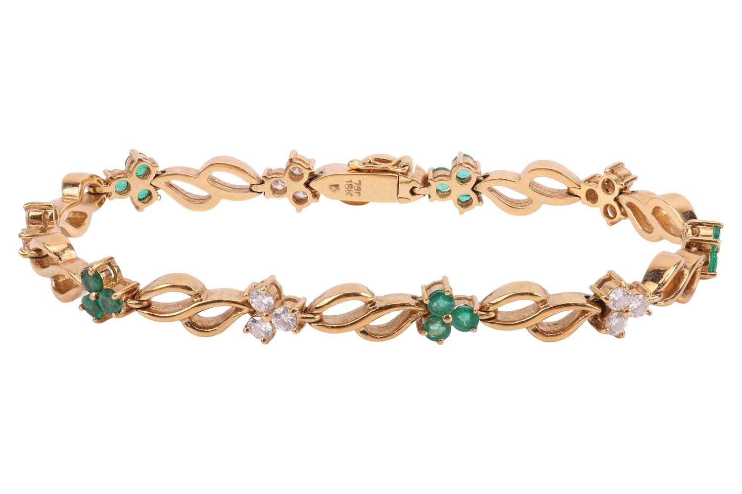 Lot 108 - An emerald and diamond bracelet, with ten...