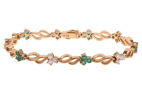 Lot 108 - An emerald and diamond bracelet, with ten...
