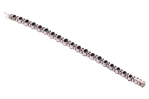 Lot 133 - A sapphire and diamond-set bracelet, featuring...
