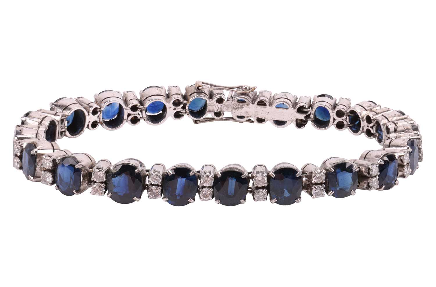Lot 133 - A sapphire and diamond-set bracelet, featuring...