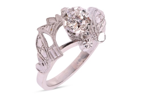 Lot 173 - A single-stone diamond ring, featuring an...