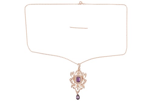 Lot 33 - An Edwardian amethyst and split pearl pendant...