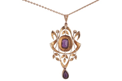Lot 33 - An Edwardian amethyst and split pearl pendant...