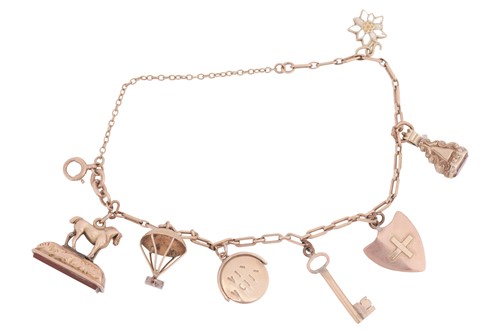 Lot 20 - A 9ct charm bracelet, including seven...