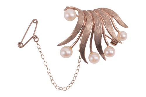 Lot 67 - A pearl-set brooch in 9ct gold, of a stylised...