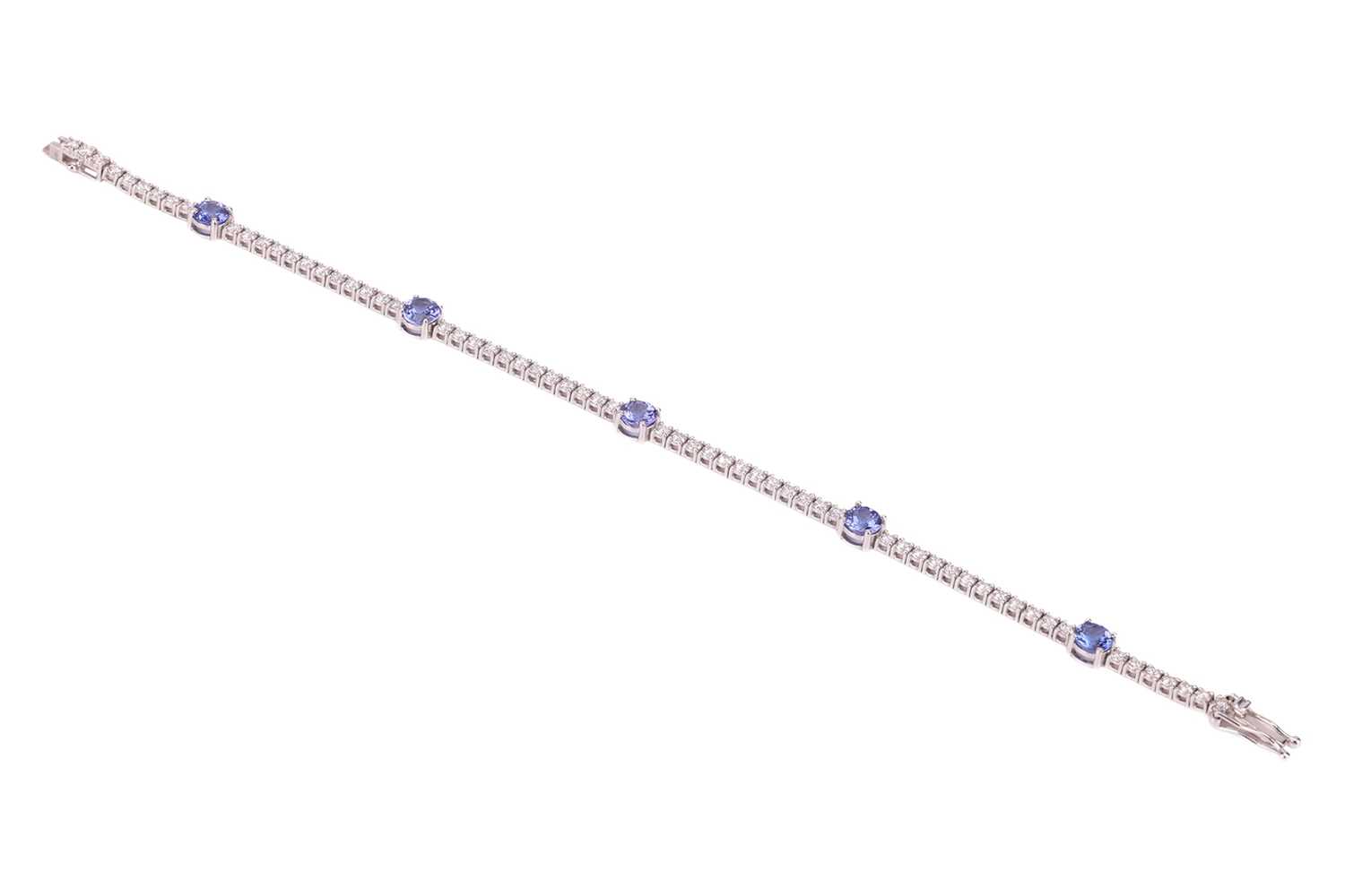 Lot 159 - A tanzanite and diamond-set bracelet,...