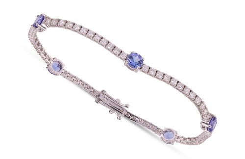 Lot 159 - A tanzanite and diamond-set bracelet,...