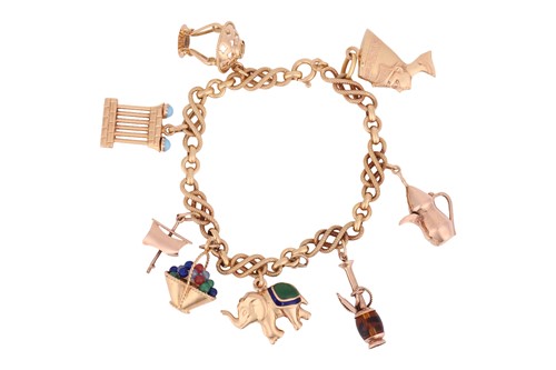 Lot 73 - An 18ct charm bracelet, the bracelet of fancy...