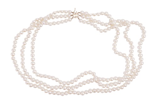 Lot 35 - A three-row cultured pearl necklace, featuring...
