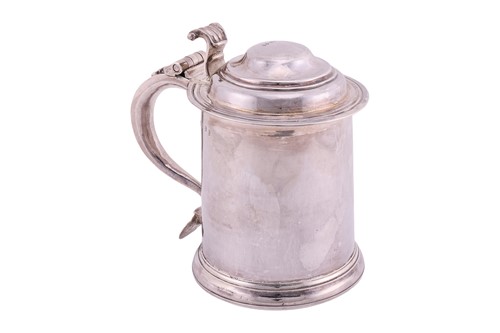 Lot A Queen Anne Britannia lidded silver tankard;...
