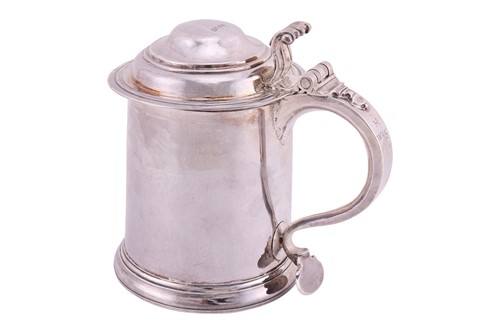 Lot A Queen Anne Britannia lidded silver tankard;...