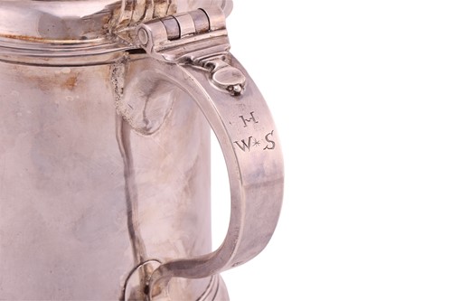 Lot A Queen Anne Britannia lidded silver tankard;...