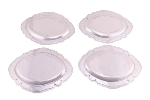 Lot 277 - A set of four George III Scottish silver meat...