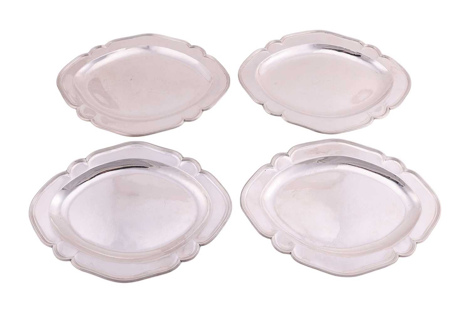 Lot 277 - A set of four George III Scottish silver meat...